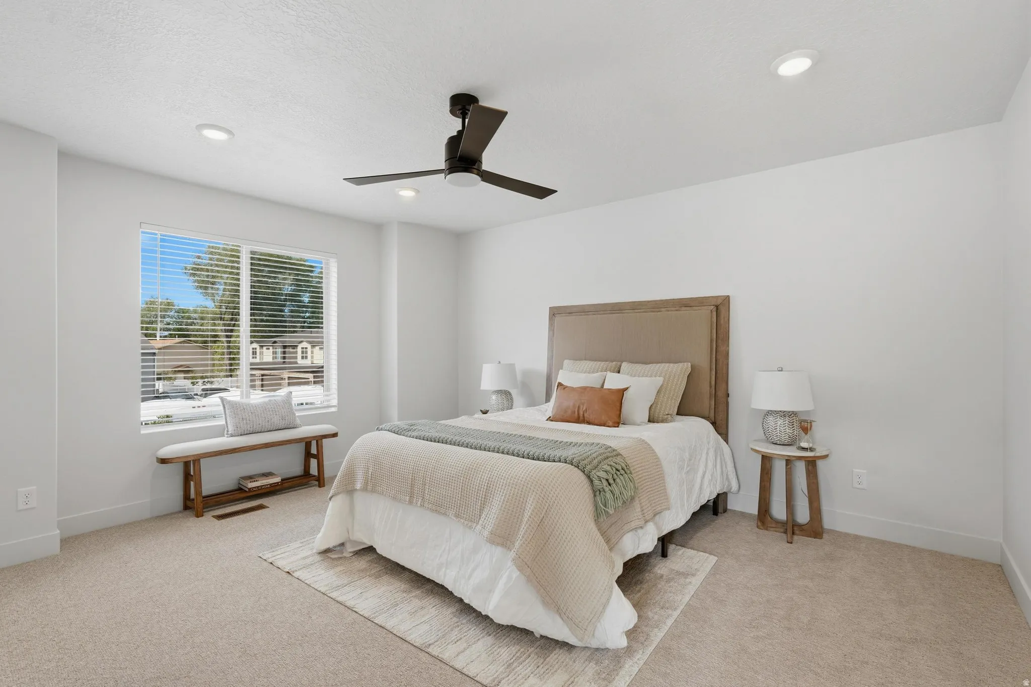 Bedroom featuring plush carpeting, a large window with blinds, recessed lighting, and a ceiling fan