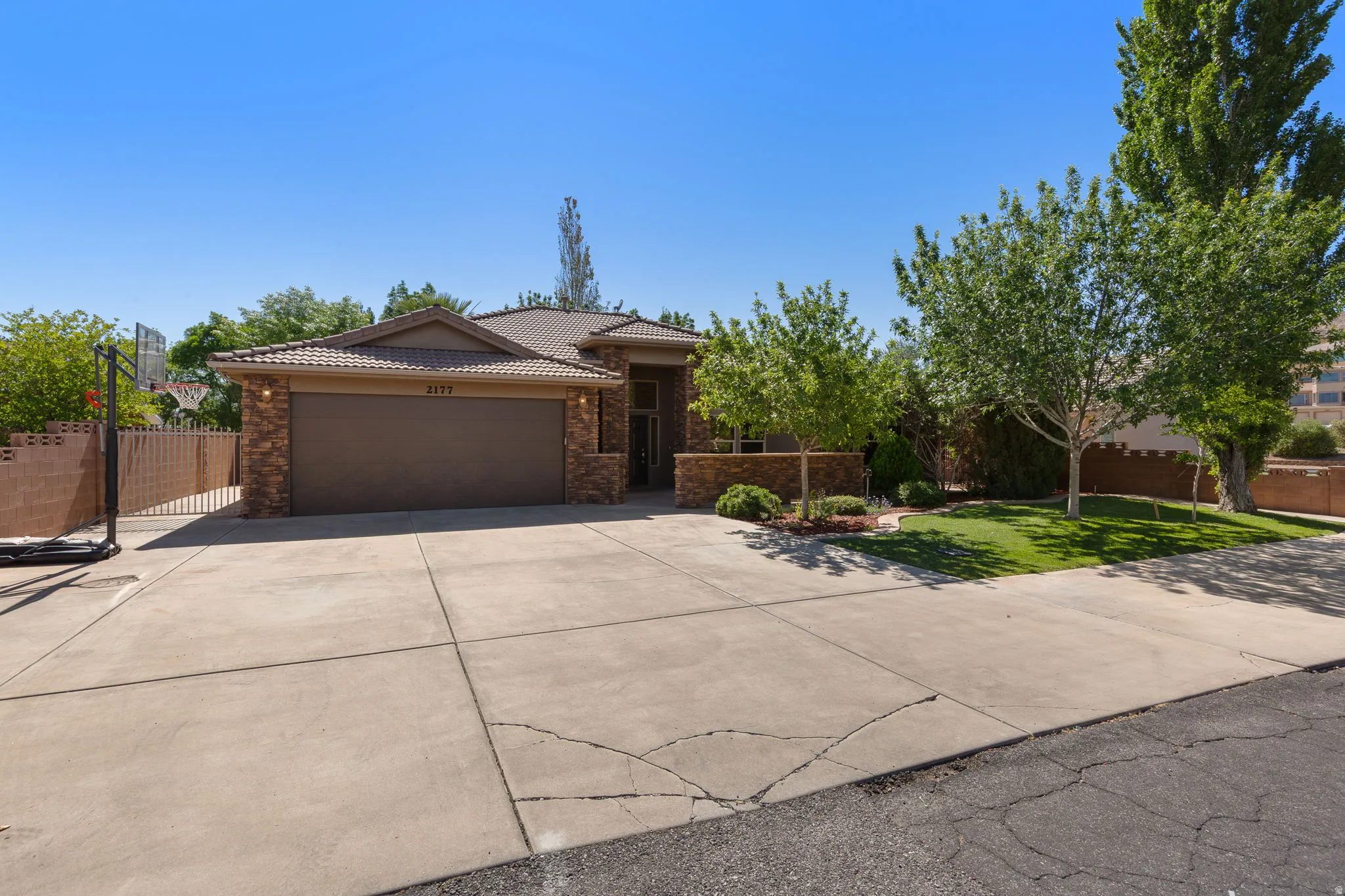 Exterior featuring a tiled roof and stone accents