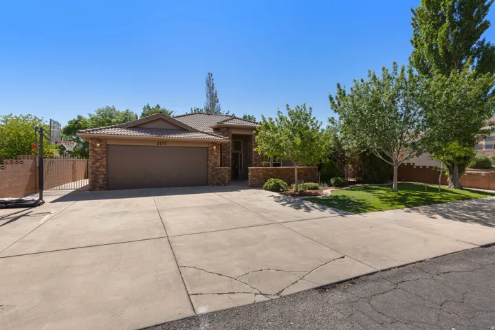 Exterior featuring a tiled roof and stone accents