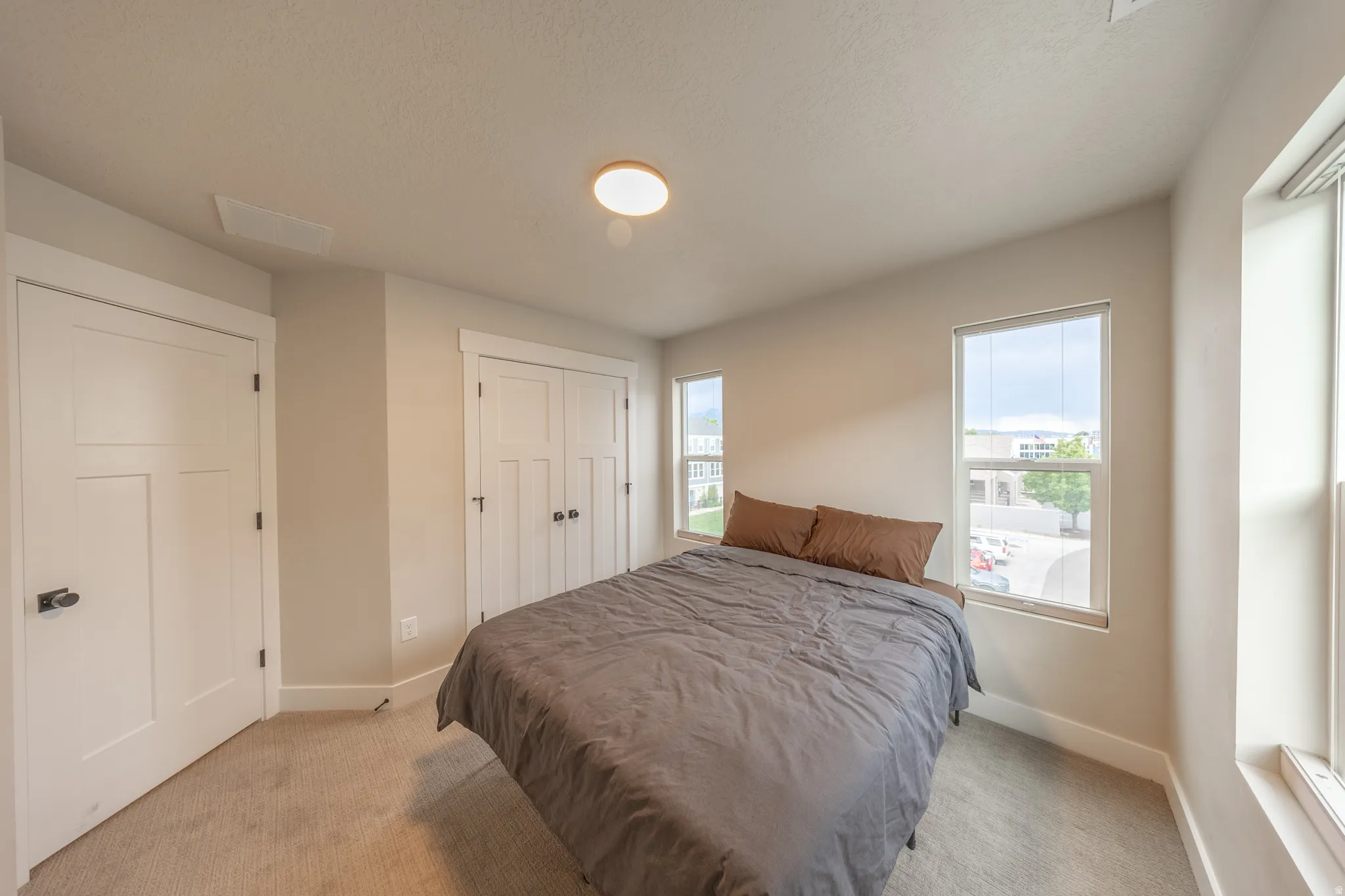 Bedroom featuring neutral carpeting and light-toned walls