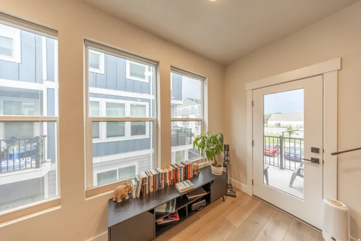 Light wood-finish flooring complements the neutral wall tones