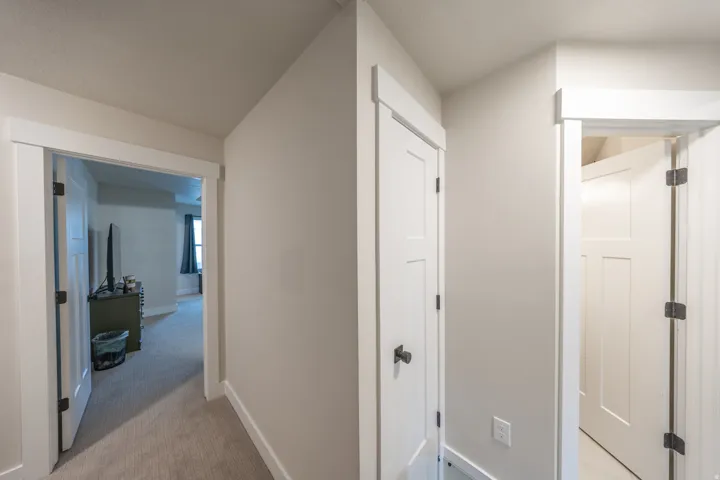 Light gray walls with white trim and baseboards throughout