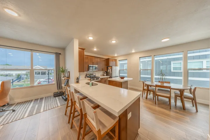 Open-concept living space with wood-finish flooring