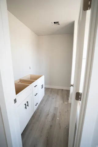 White shaker-style cabinetry with matte black hardware