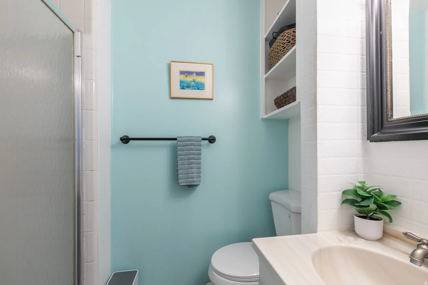 Primary bath with shower and built-in shelving