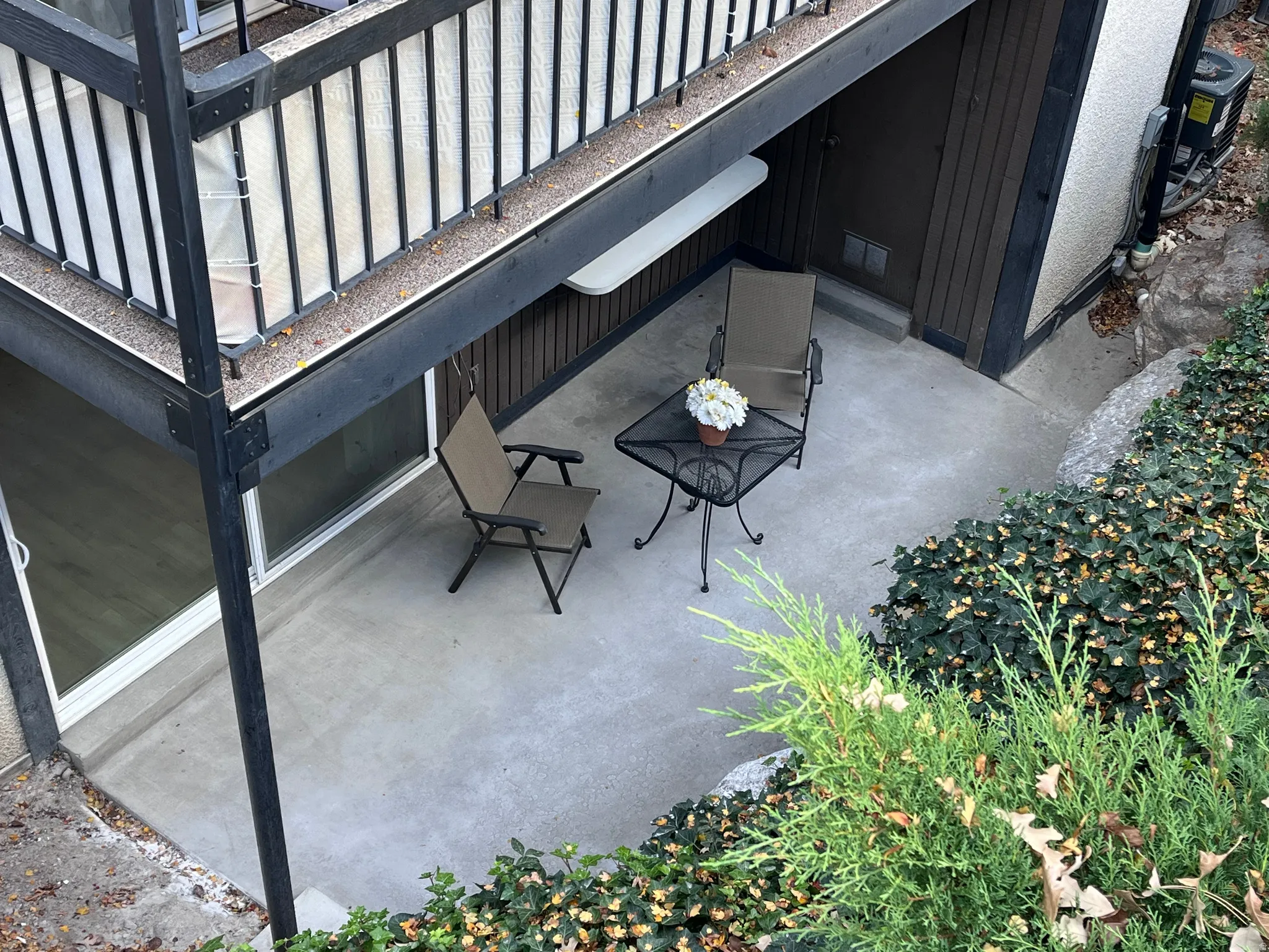 Spacious private patio with surrounding mature greenery