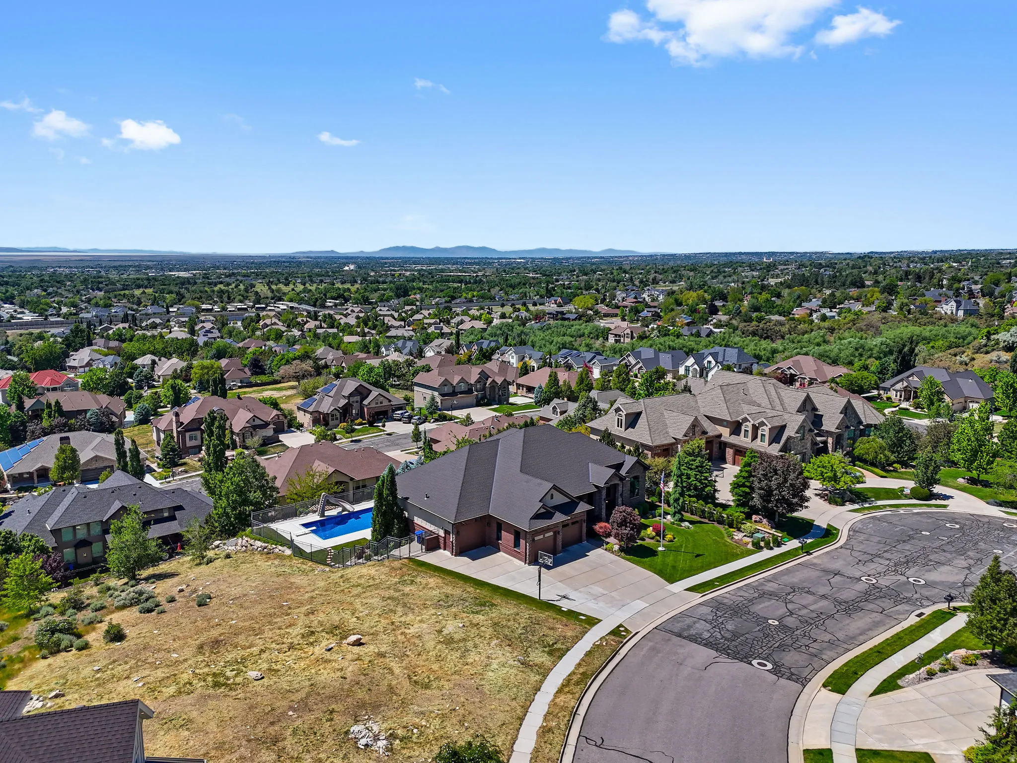 Expansive property with a dark-pitched roof and brick exterior