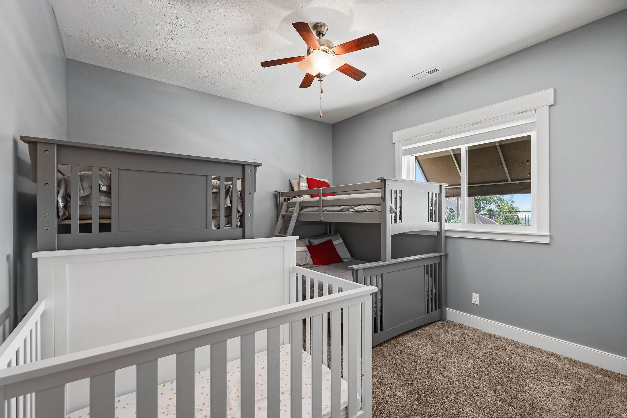 Room featuring light gray painted walls and brown carpet flooring