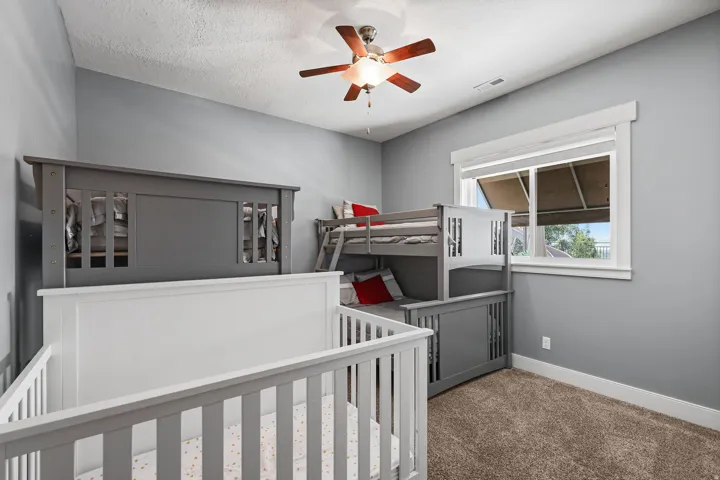 Room featuring light gray painted walls and brown carpet flooring