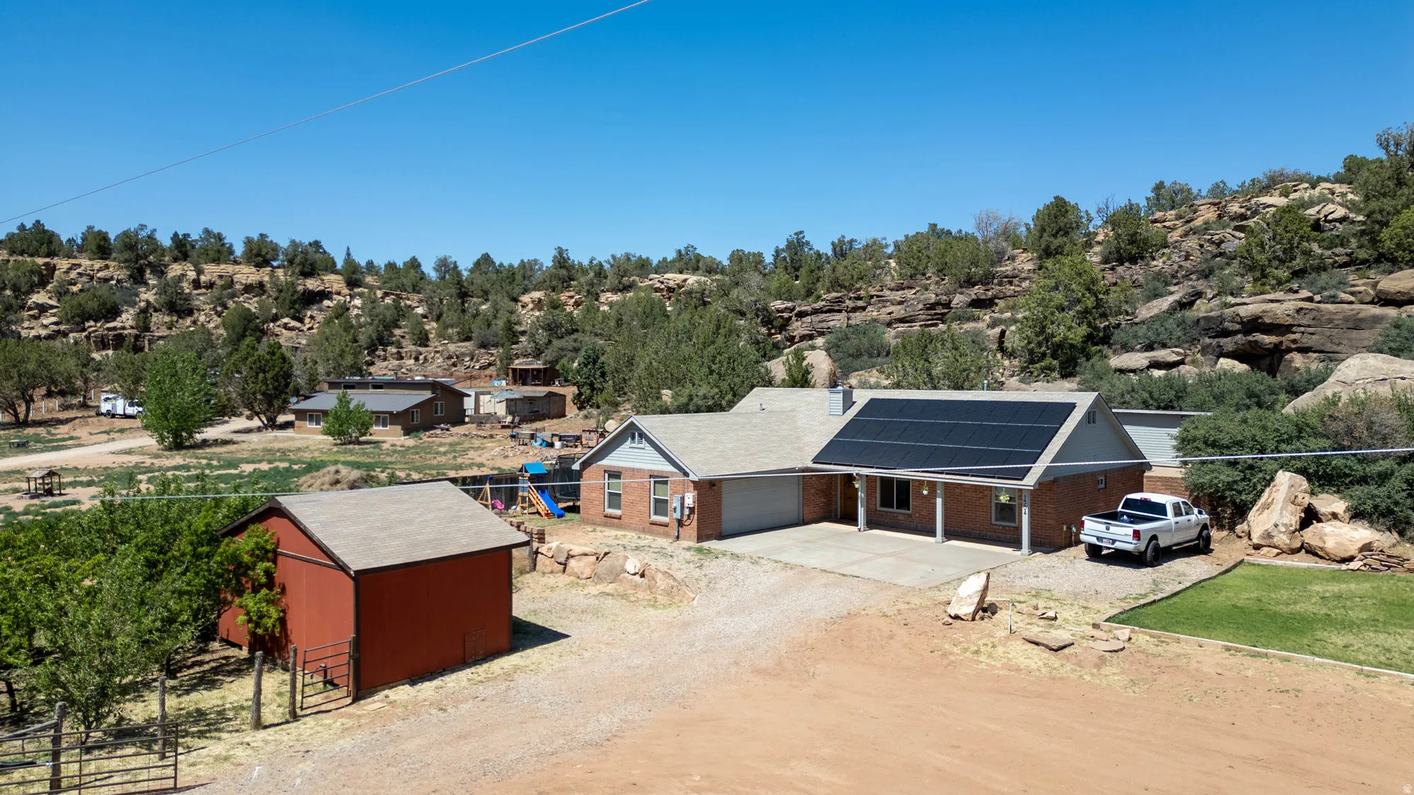 Brick residence with an attached garage and solar panels