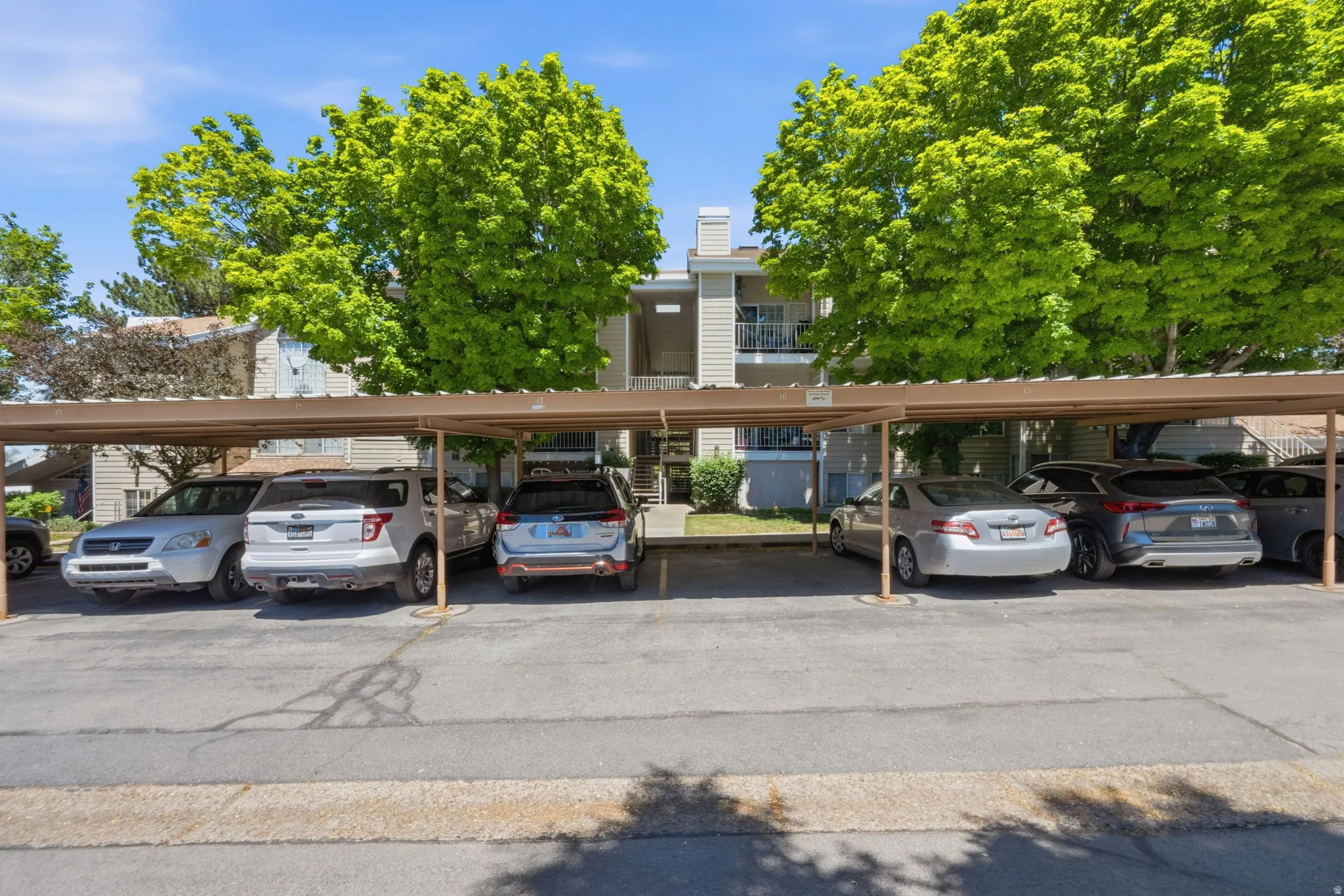 Covered parking structure with multiple vehicle spaces