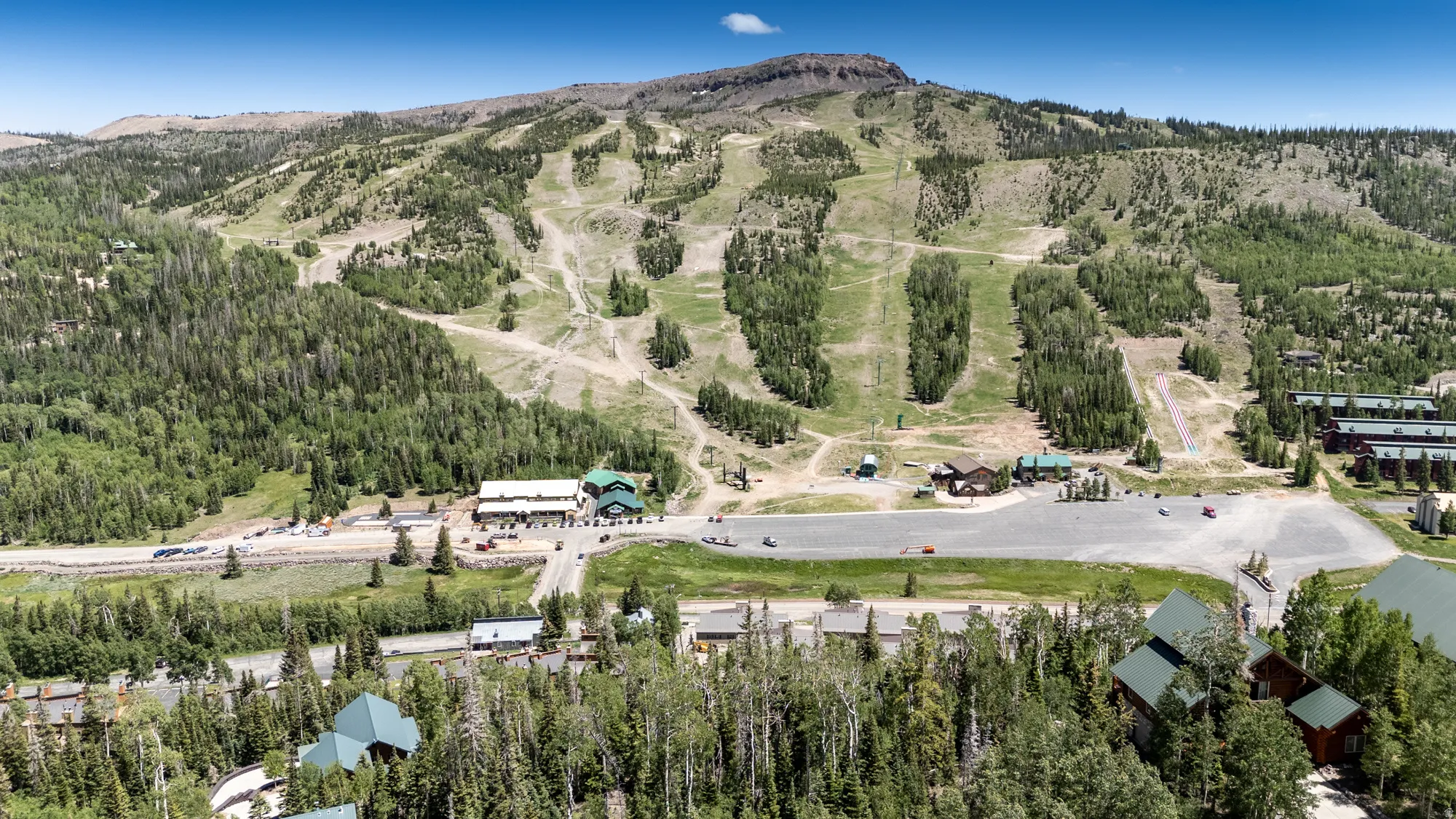 Mountain resort community featuring extensive ski slopes, multiple lodges, and surrounding forest
