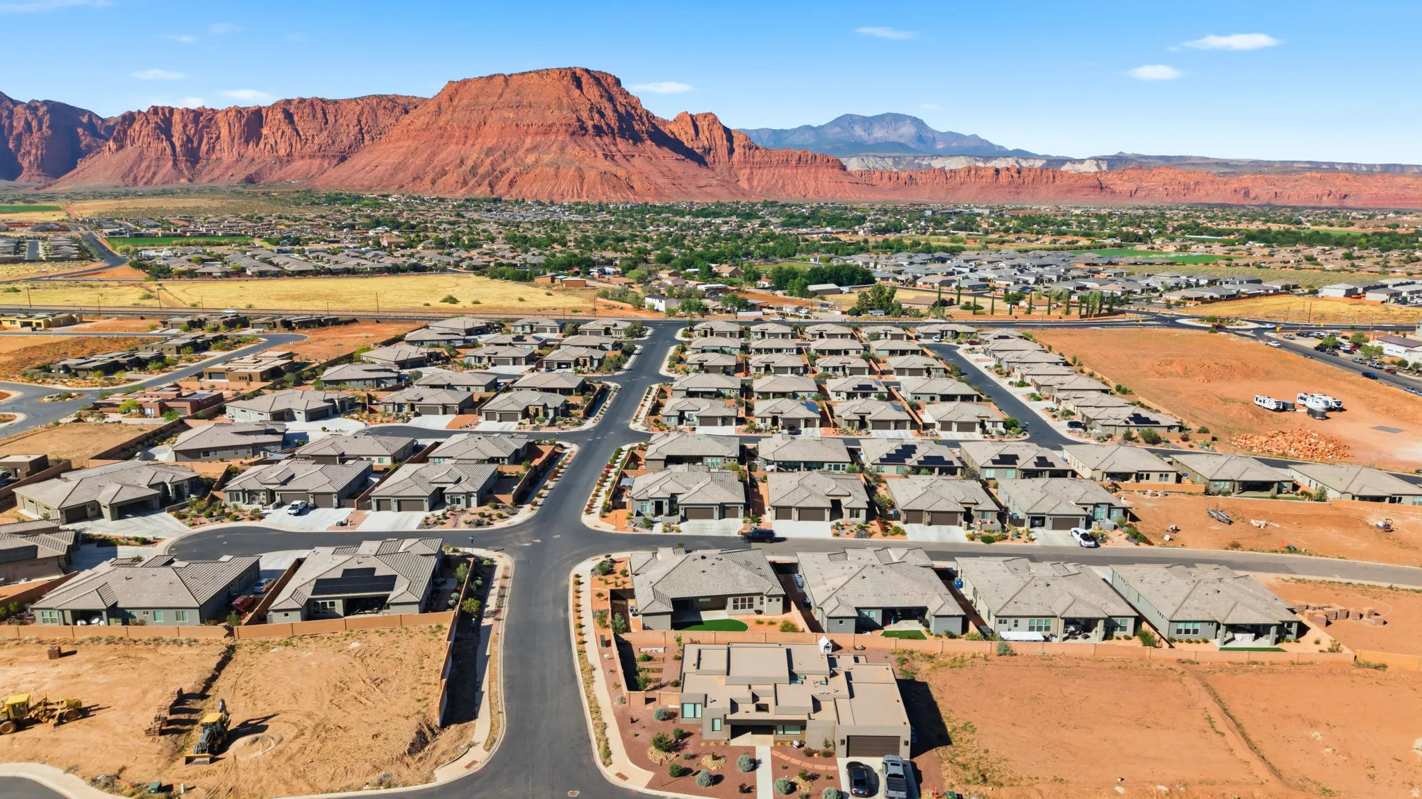 Expansive residential development featuring numerous single-story homes with neutral-toned roofs