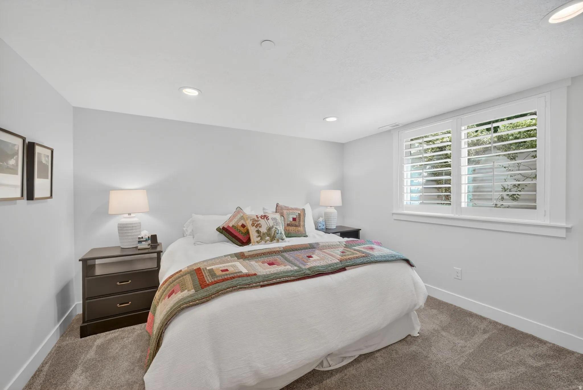Mother in Law Bedroom featuring recessed lighting, light gray walls, white trim, and gray carpet flooring