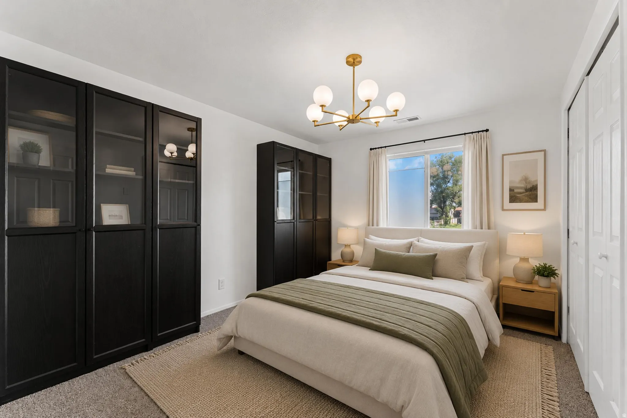Bright room featuring a contemporary brass chandelier with globe lights, dual-pane window, white trim, and a built-in wardrobe system with glass-front doors