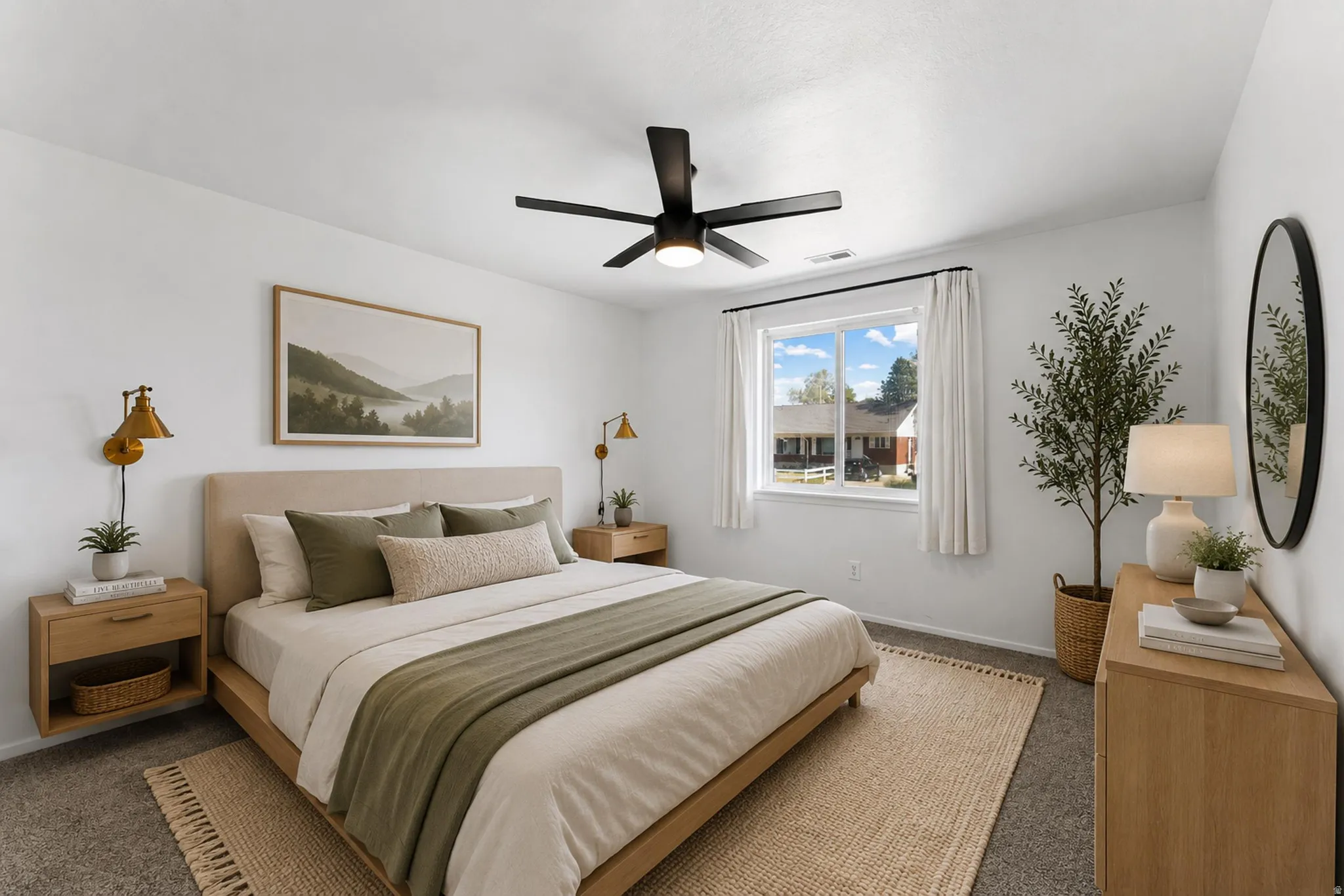 Bright bedroom space featuring a contemporary black ceiling fan with integrated lighting, a large window with white trim, and neutral-toned carpeting