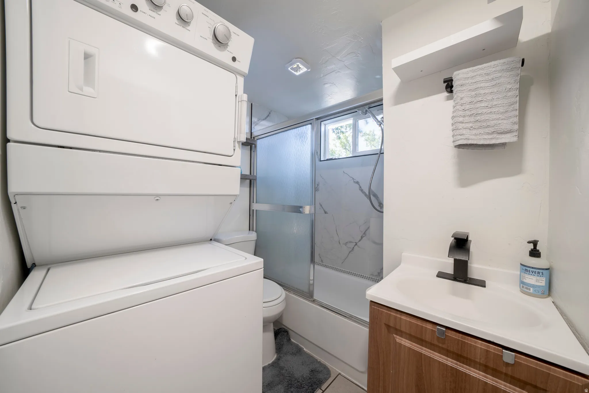 Integrated stackable laundry appliances