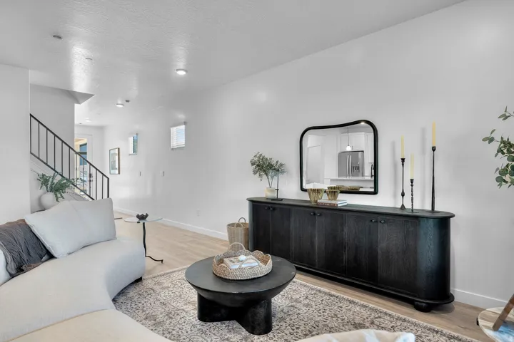 Interior space featuring light wood-finish flooring and a contemporary black console table with integrated storage
