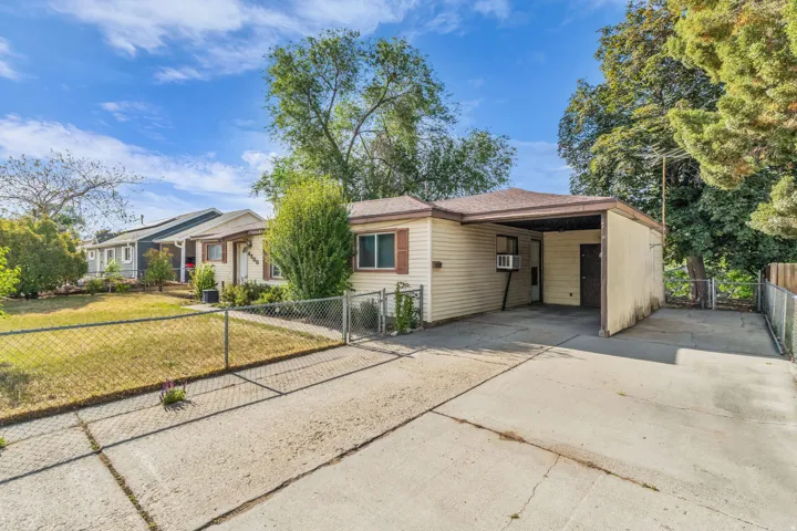 Single-story property featuring horizontal siding and a covered carport