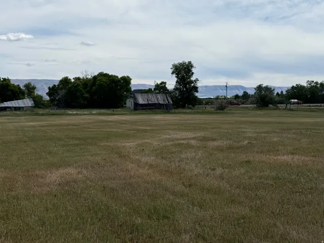 Expansive open field with distant mountain range