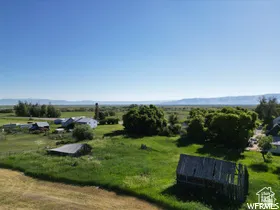 Expansive green landscape with distant mountains