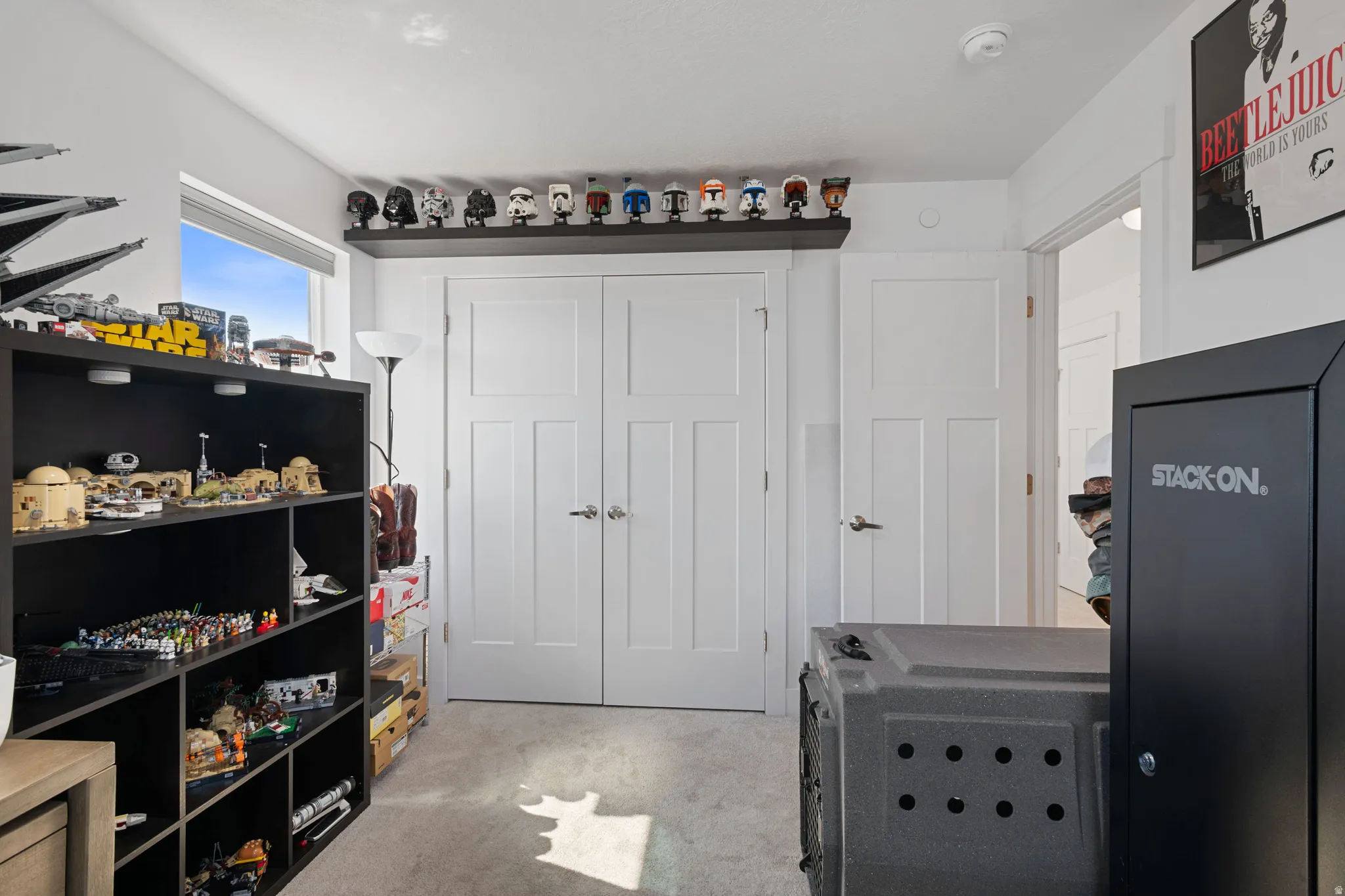 Recessed window offering natural light, plush carpeted flooring, and white paneled doors