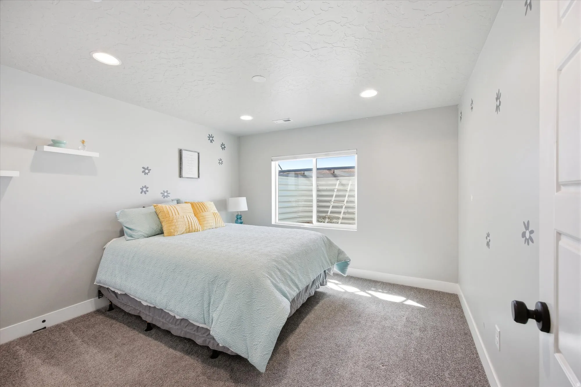 Neutral wall tones complemented by recessed ceiling lighting