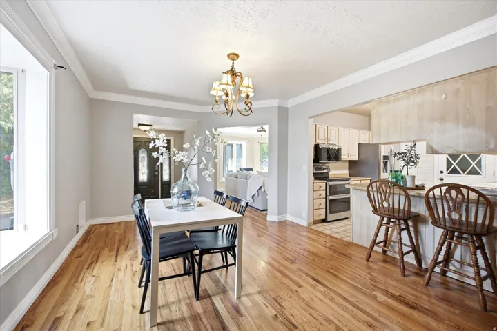 Hardwood flooring extends through the dining area