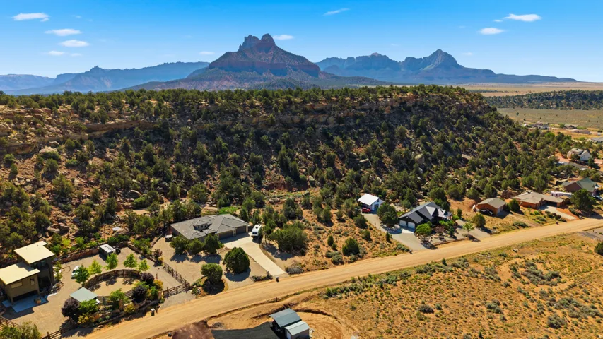 Expansive property featuring rugged mountain scenery and natural desert landscaping