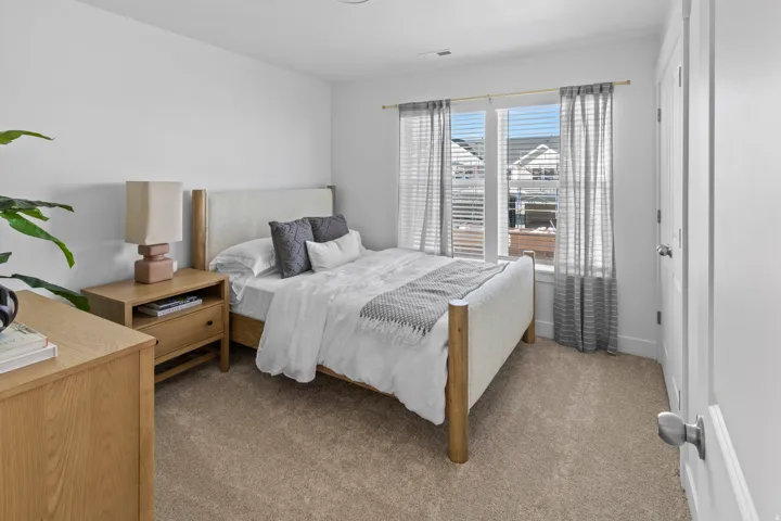 Bedroom featuring neutral-toned carpeting and light-colored walls