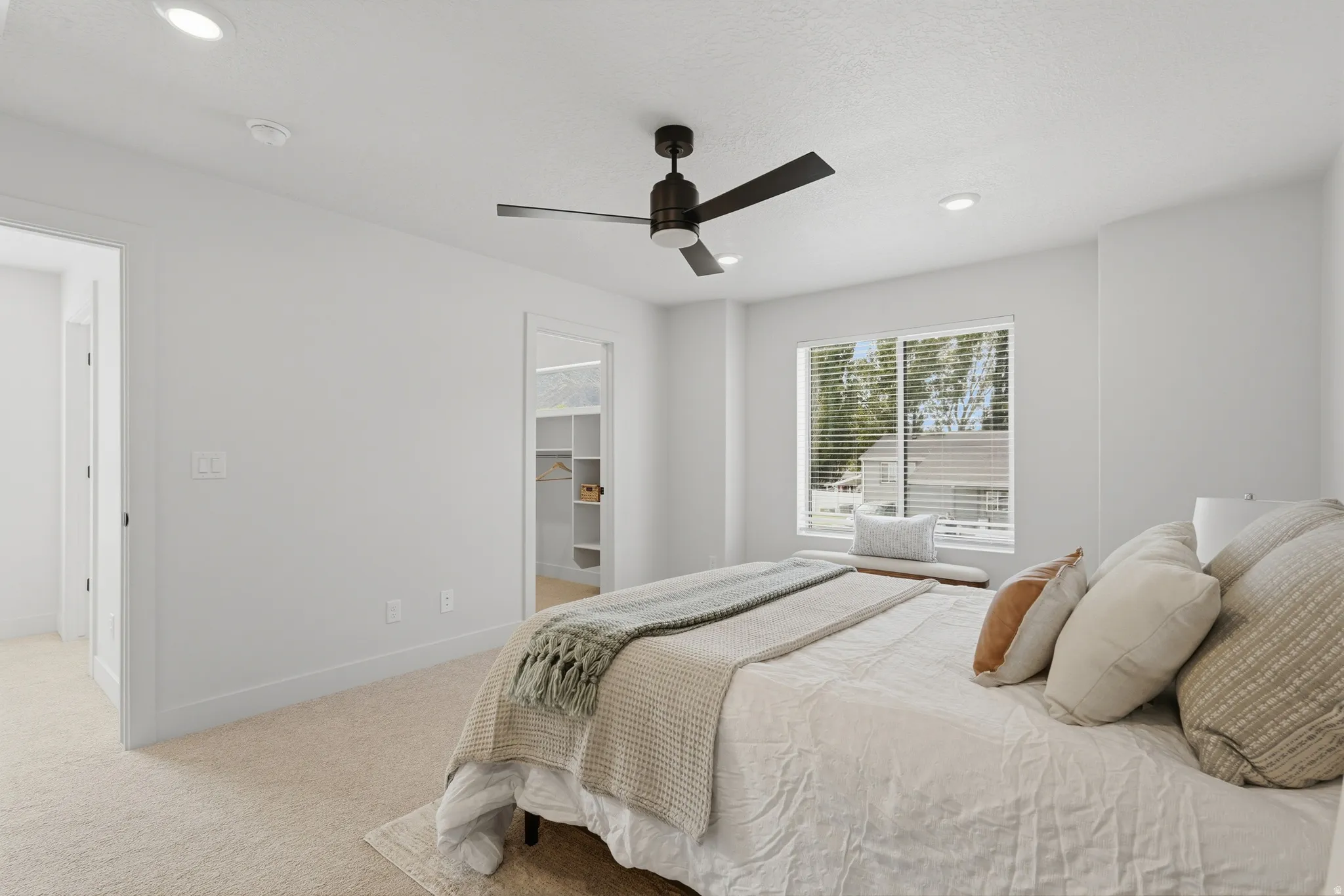 Bedroom featuring neutral carpet flooring, recessed lighting, a modern ceiling fan, and a window with blinds
