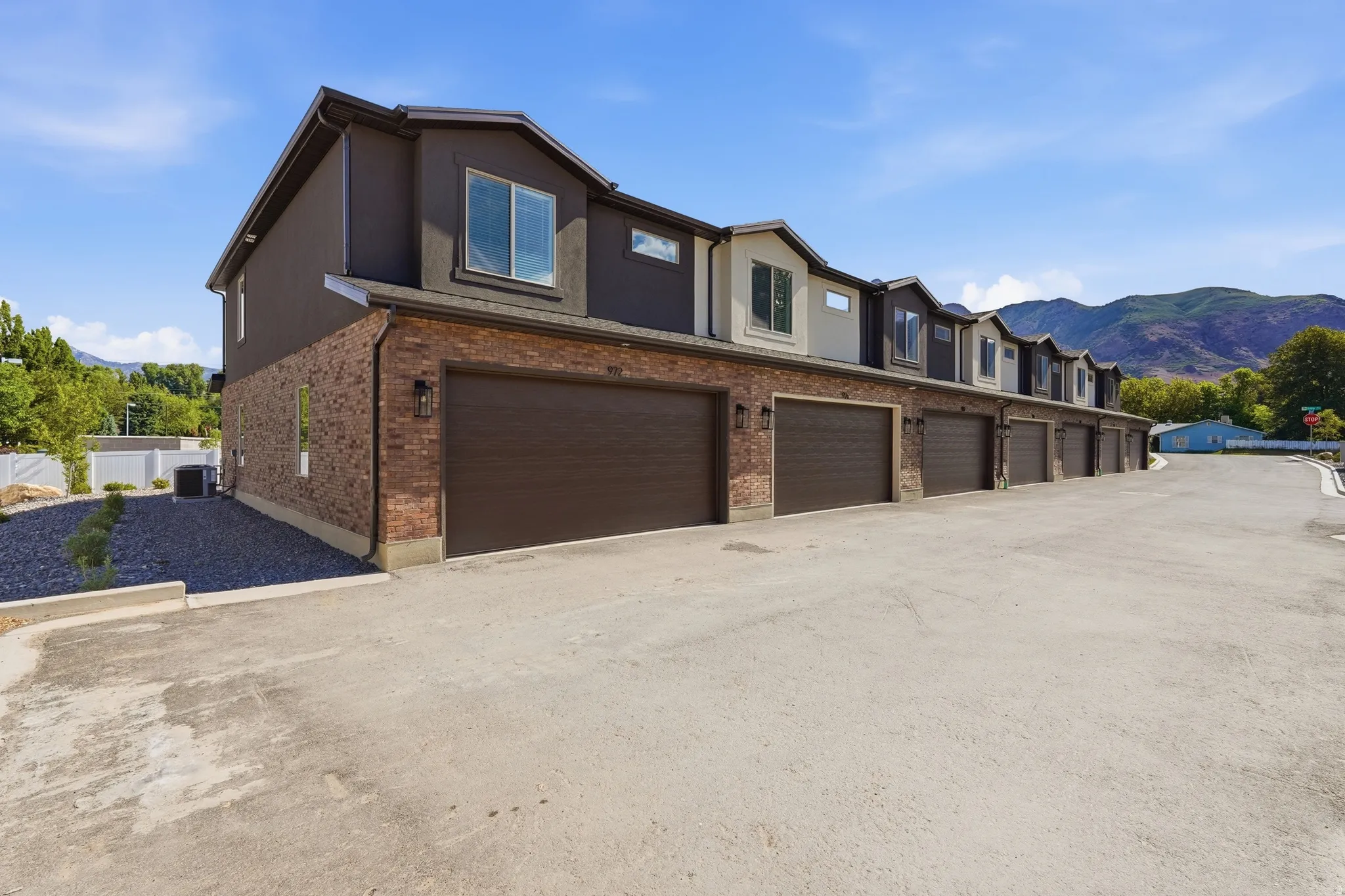 Townhome exteriors featuring brick and stucco finishes