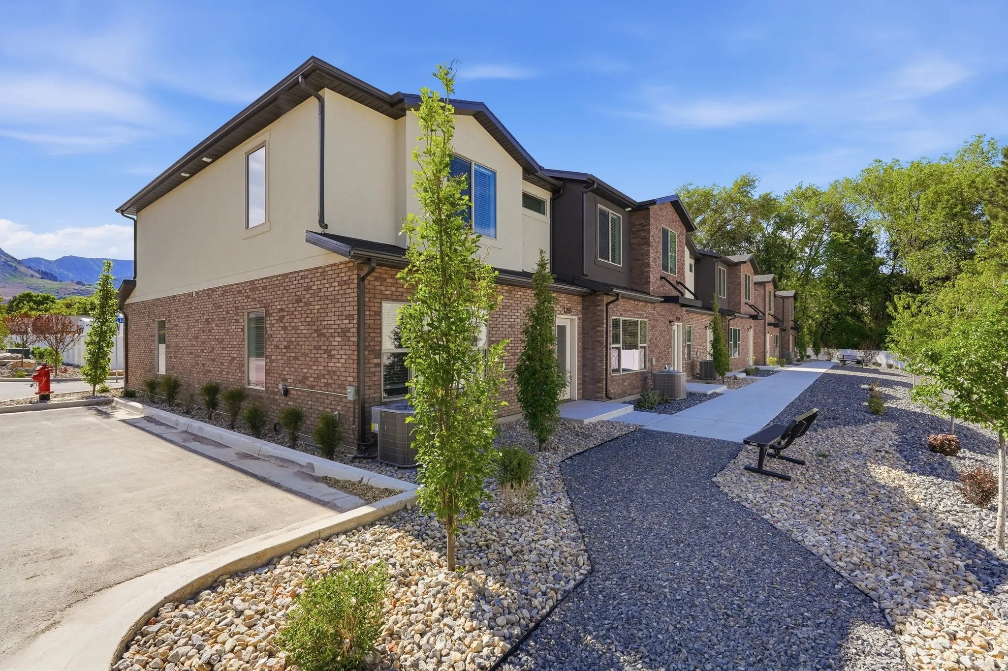 Modern townhome complex featuring brick and stucco facades