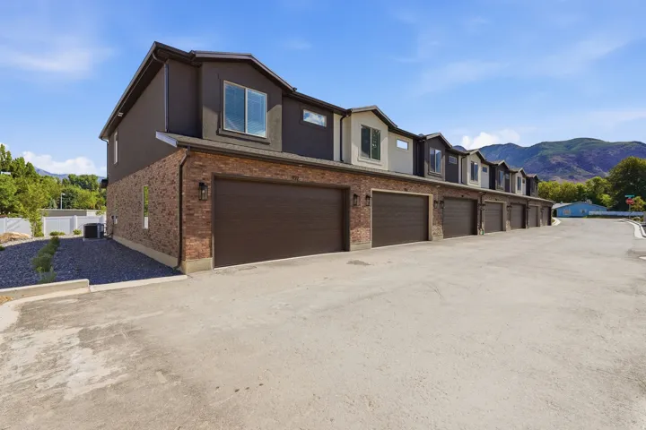 Townhome exteriors featuring brick and stucco finishes