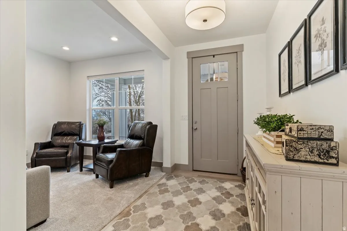 Entryway featuring a Craftsman-style door with upper window panes, recessed lighting, and a white flush-mount ceiling fixture