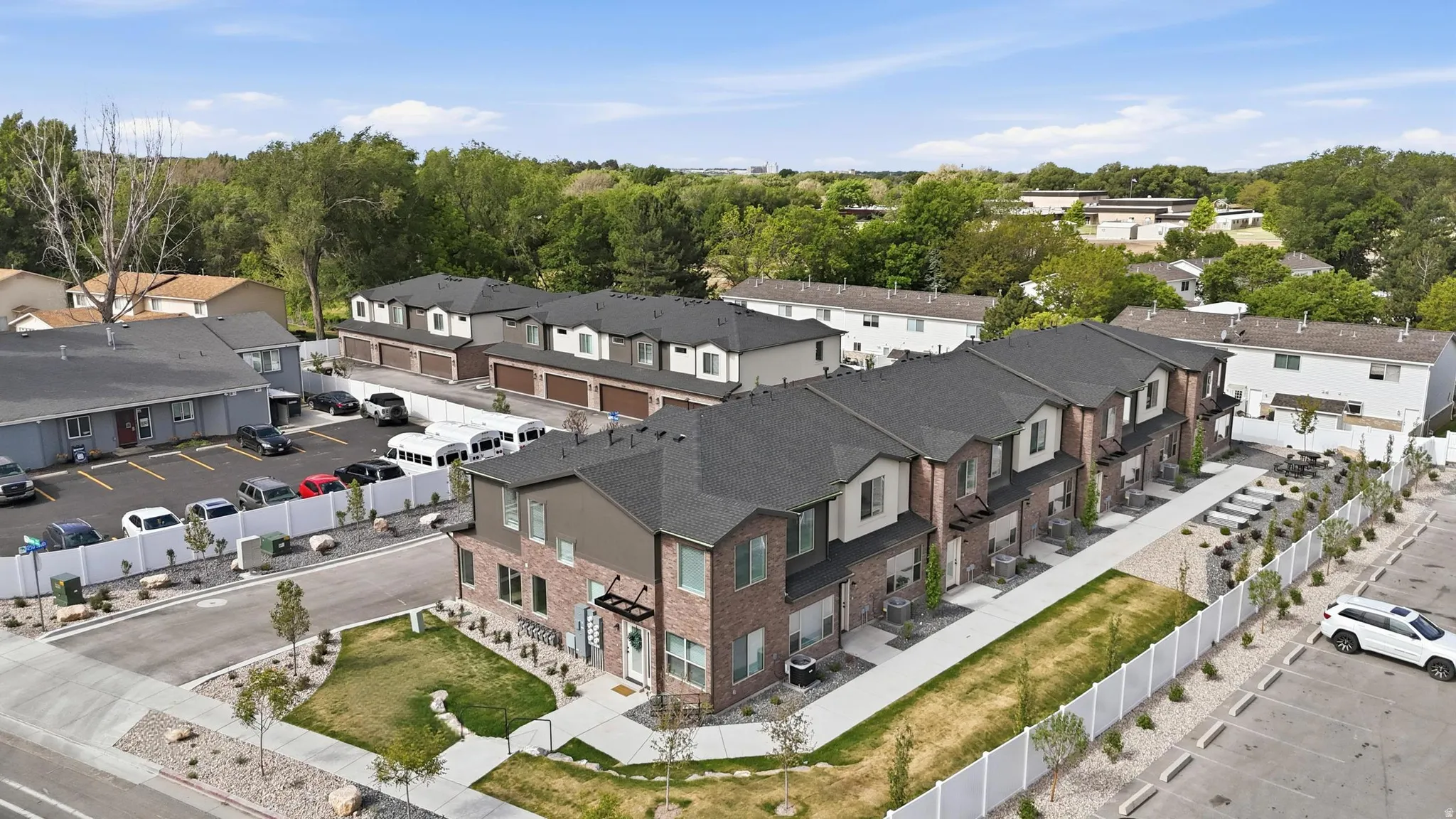 Modern townhome development featuring a brick and siding exterior