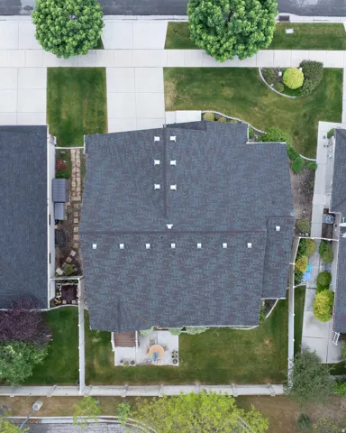 Asphalt shingle roofing with multiple ventilation fixtures