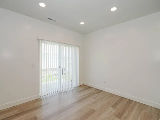 Room featuring light wood-finish flooring and white baseboards