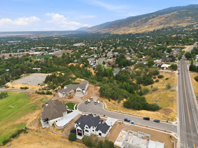 Aerial perspective highlighting a developing residential street with multiple properties under construction