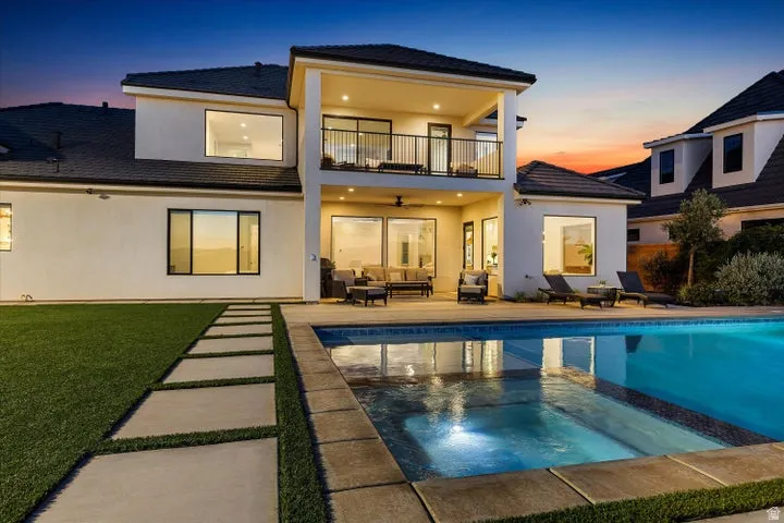Contemporary two-story exterior with an integrated swimming pool and spa
