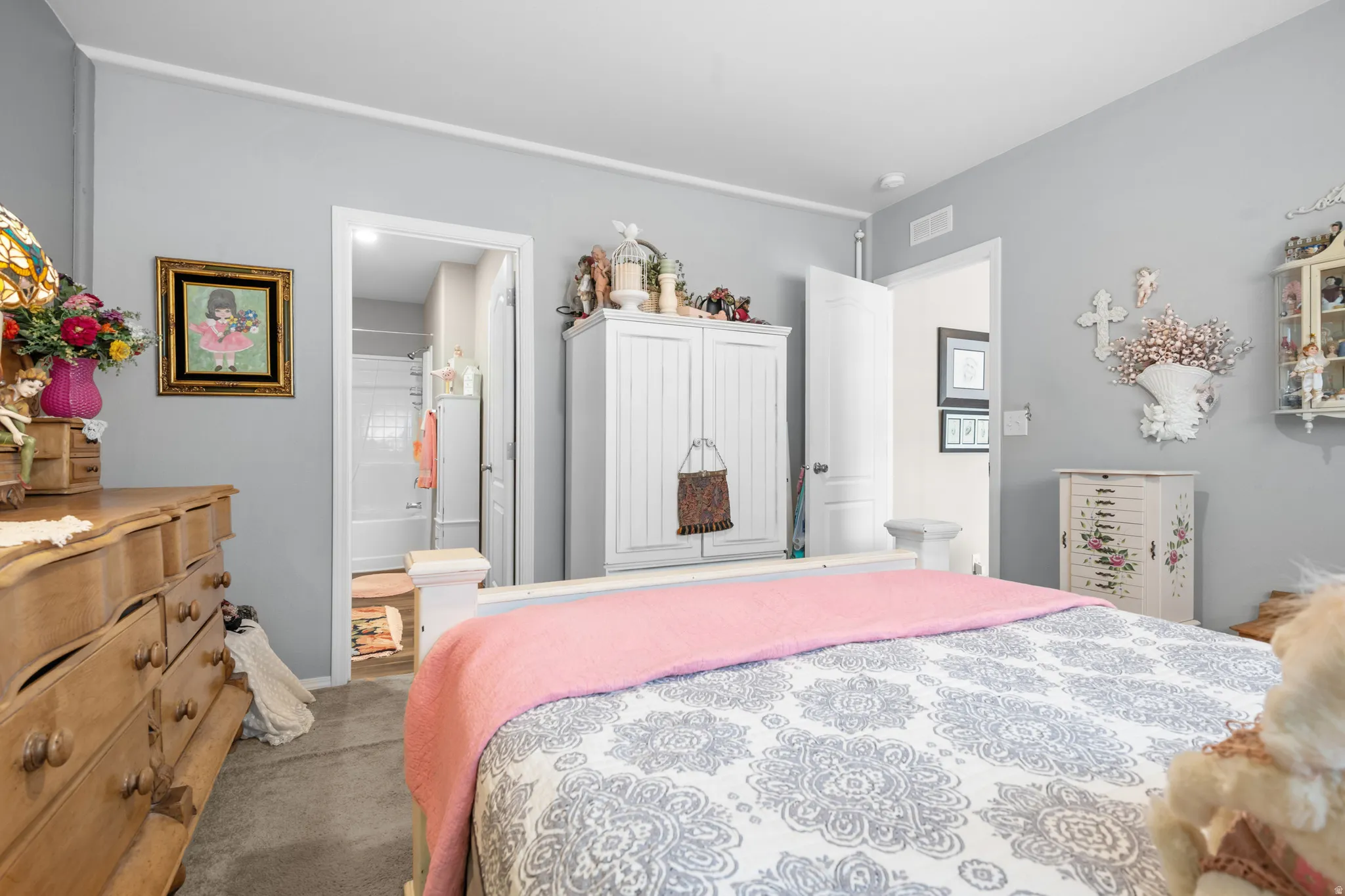 Bedroom featuring light gray walls and white trim