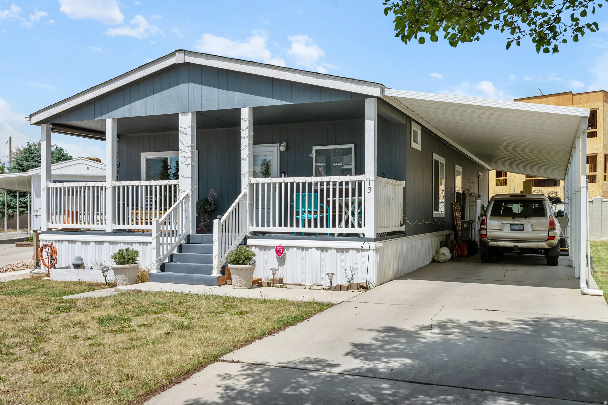 Single-story residence featuring blue horizontal siding and white trim