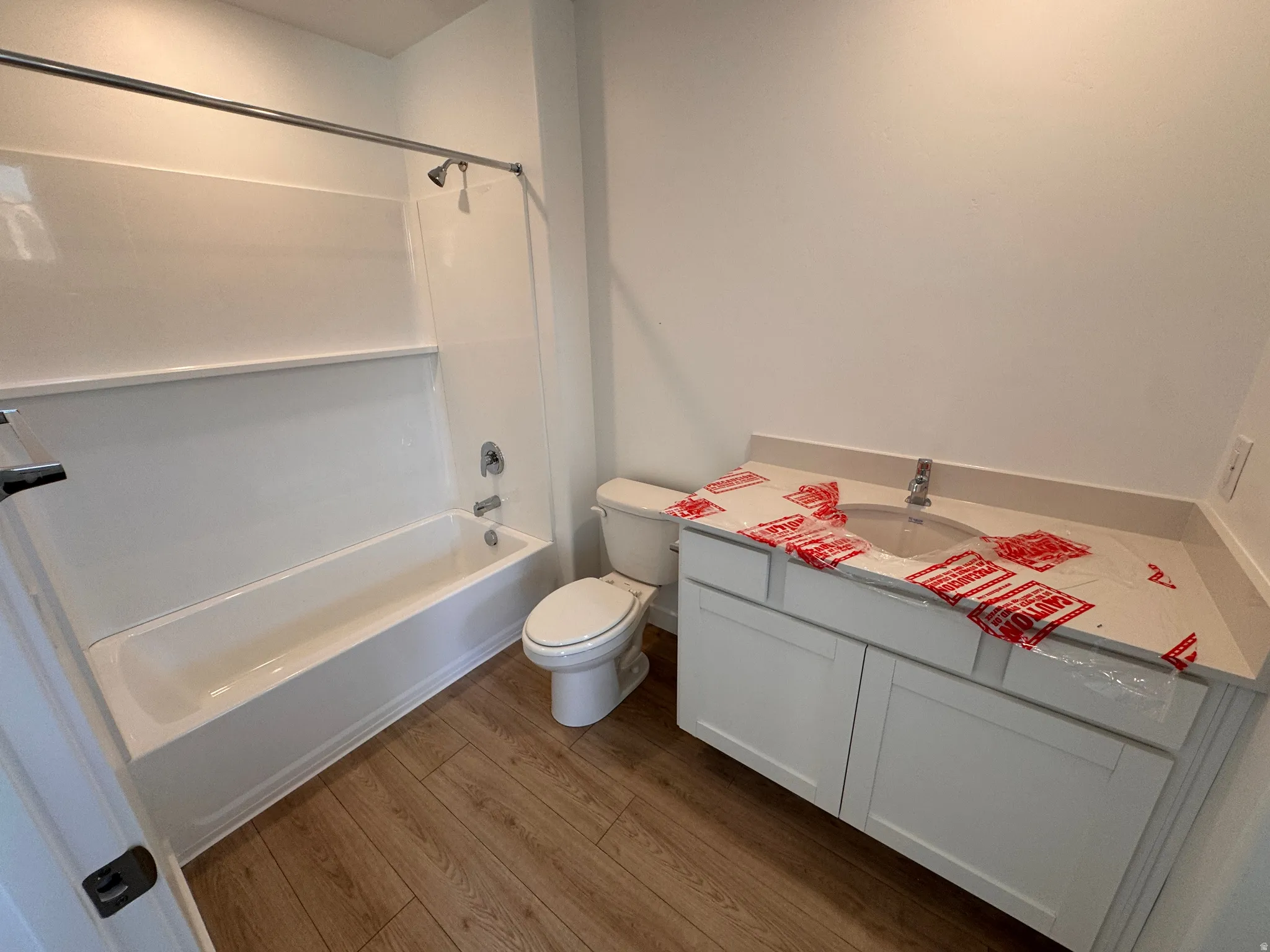 Bathroom featuring a white vanity with a light-colored countertop and undermount sink