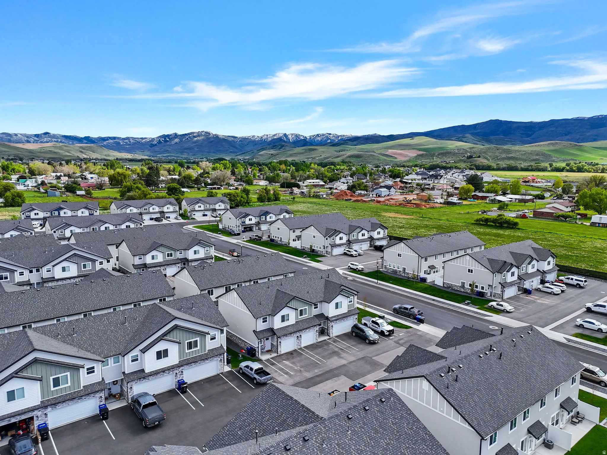 Modern townhome community with pitched roofs and attached garages
