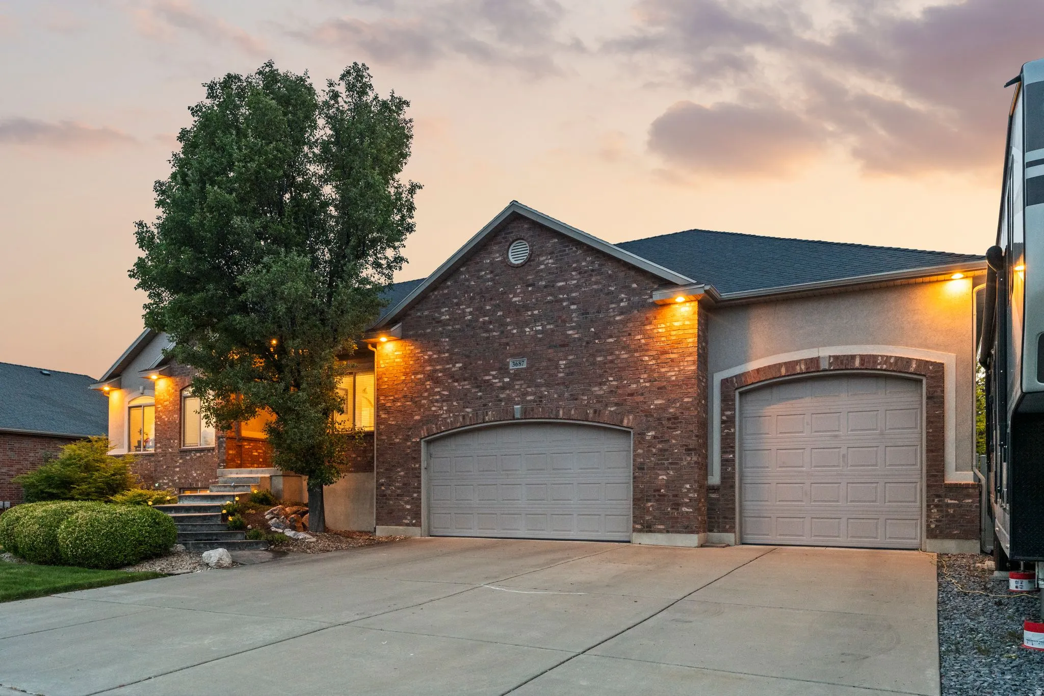 Brick and stucco exterior with multiple gables