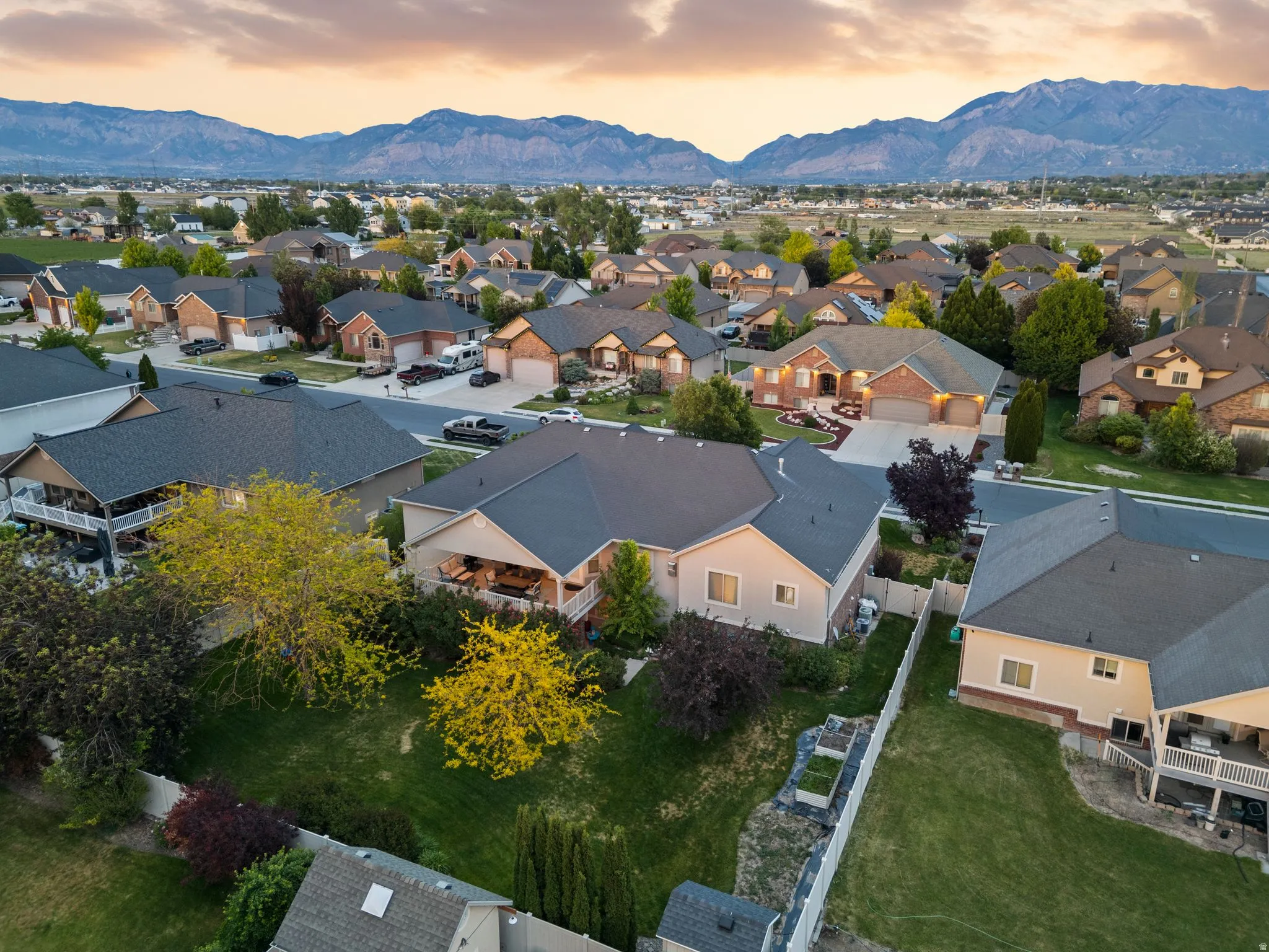 Expansive residential neighborhood featuring single-family homes with pitched roofs and attached garages