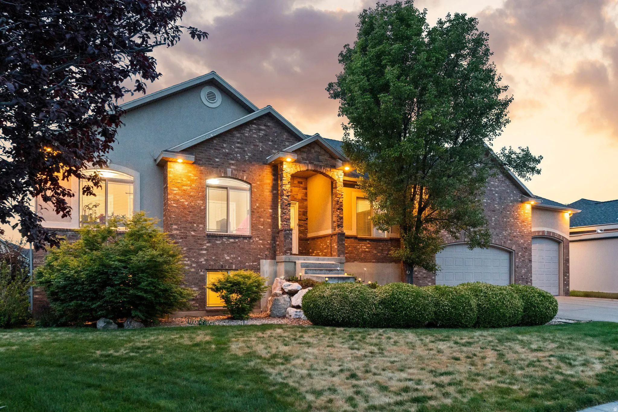 Brick and stucco exterior with multiple gables