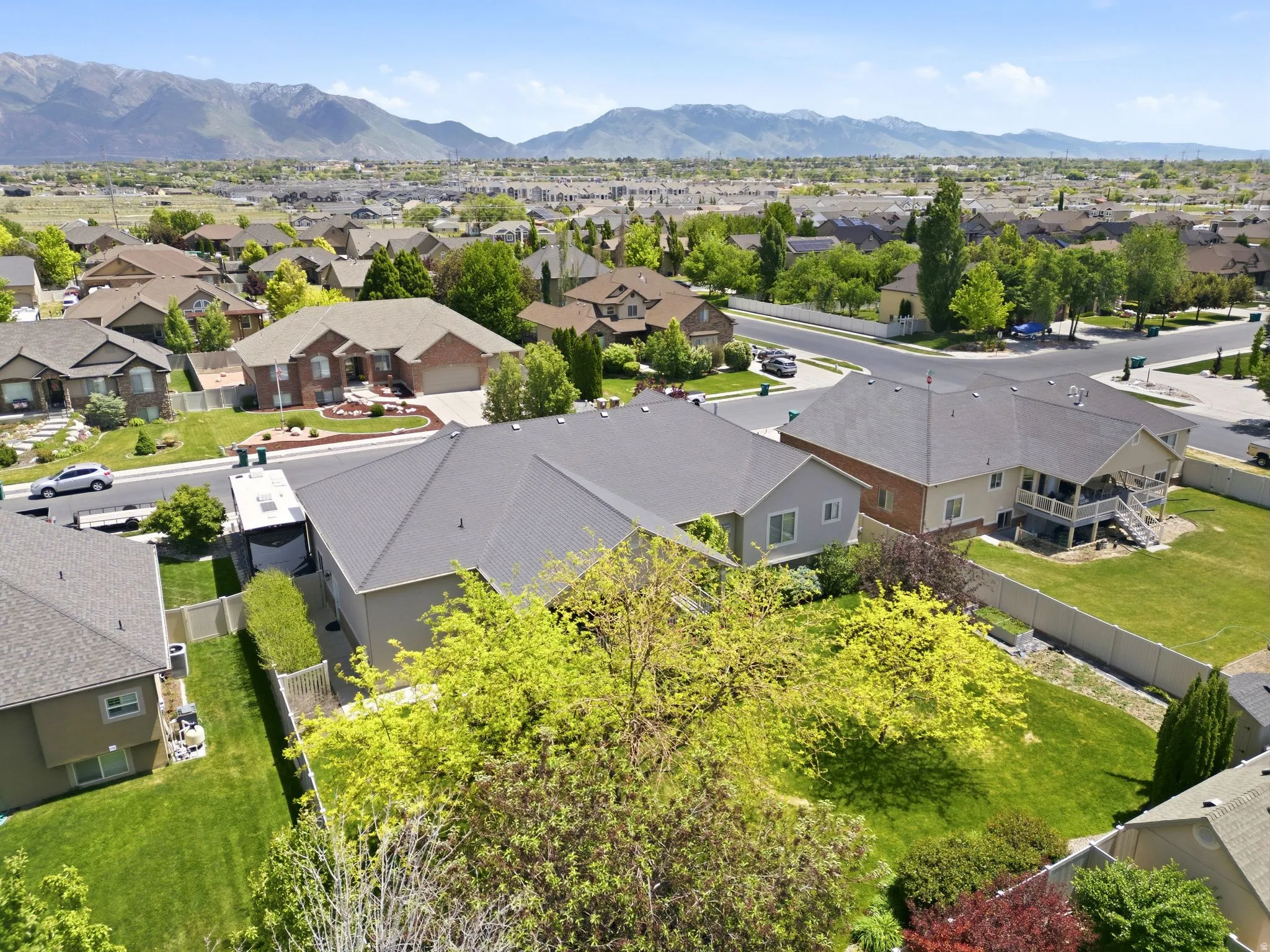 Expansive residential neighborhood featuring numerous single-family homes with pitched roofs and mature landscaping