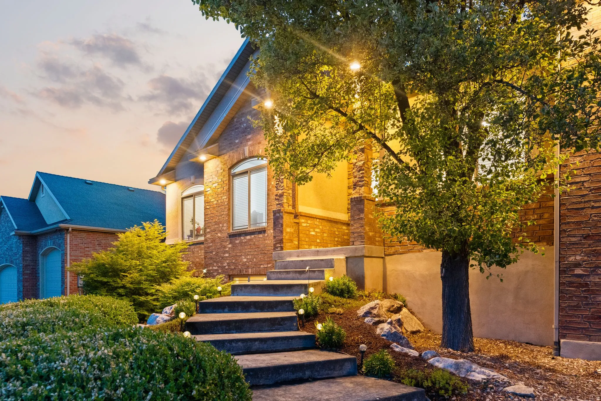 Brick exterior with stone accents and arched windows