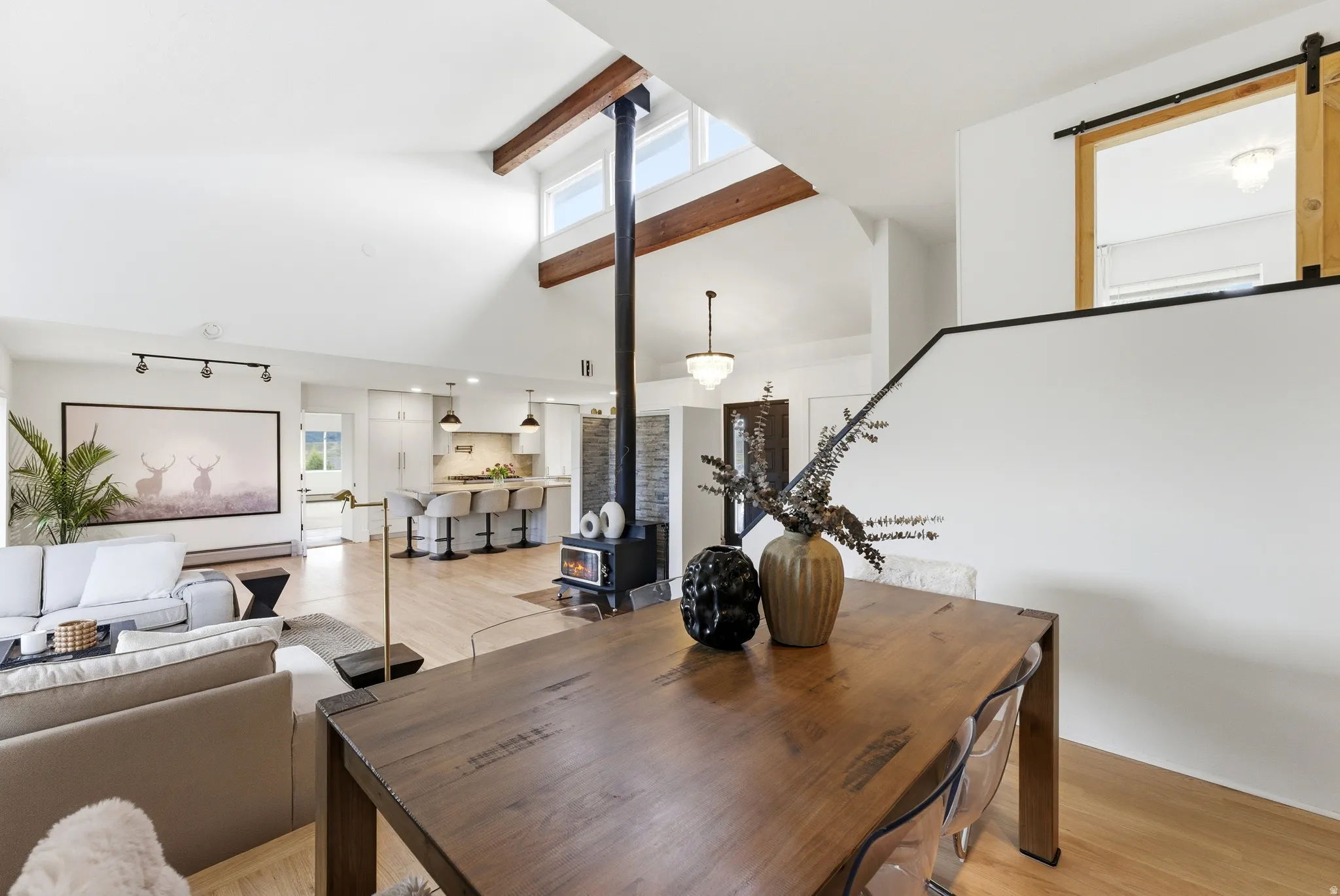 Vaulted ceiling with exposed wood beams and clerestory windows